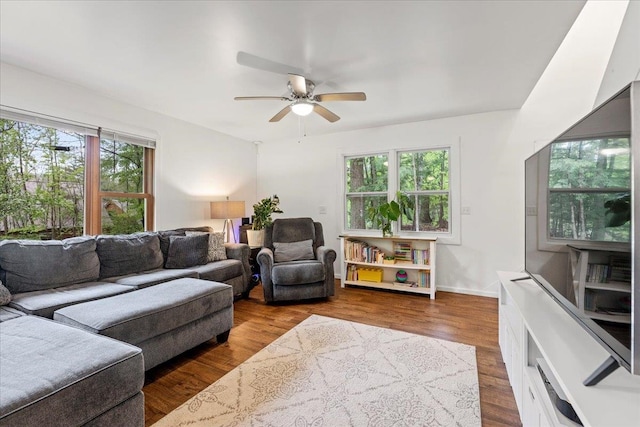 living room featuring ceiling fan, a healthy amount of sunlight, and hardwood / wood-style floors