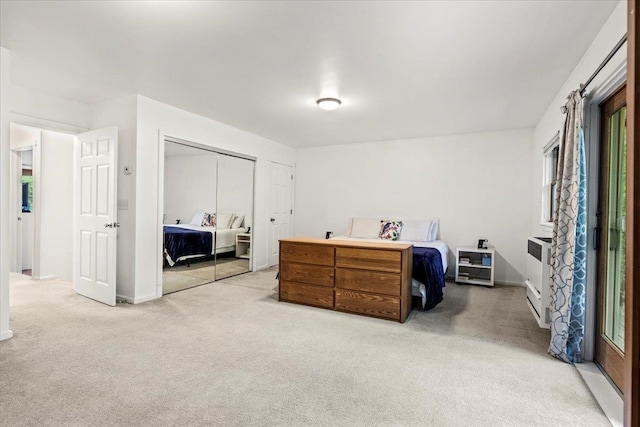 bedroom with light carpet and a closet