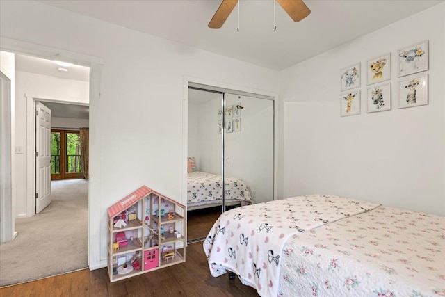 bedroom with wood-type flooring, ceiling fan, and a closet