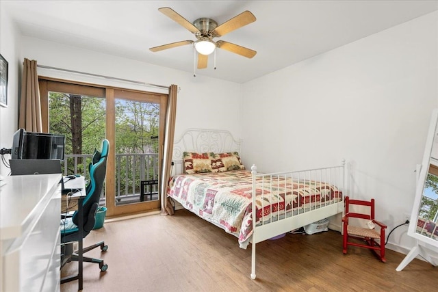 bedroom with hardwood / wood-style flooring, ceiling fan, and access to exterior