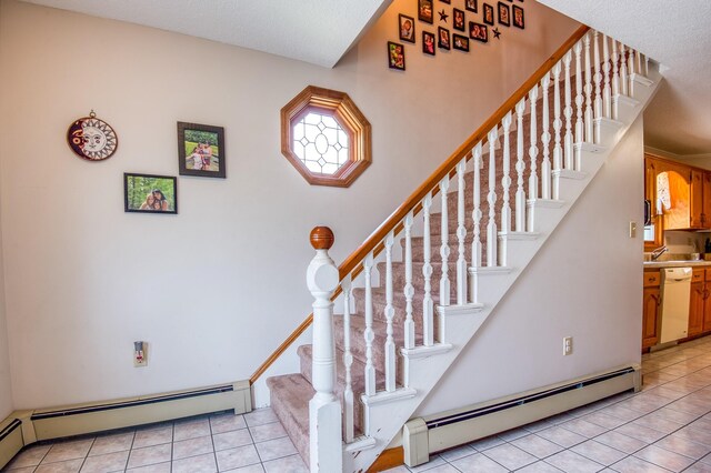 staircase featuring a baseboard radiator and light tile floors