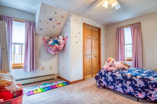 bedroom featuring a baseboard radiator, a textured ceiling, a closet, ceiling fan, and light colored carpet