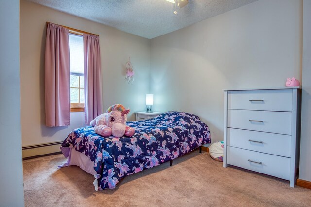 bedroom with a textured ceiling, ceiling fan, a baseboard radiator, and light colored carpet