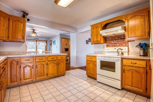 kitchen with ceiling fan, crown molding, white electric stove, a textured ceiling, and light tile floors