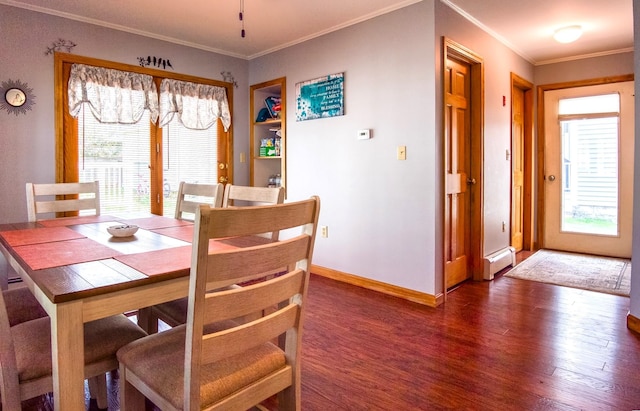 dining space with a wealth of natural light, dark hardwood / wood-style flooring, a baseboard radiator, and ornamental molding