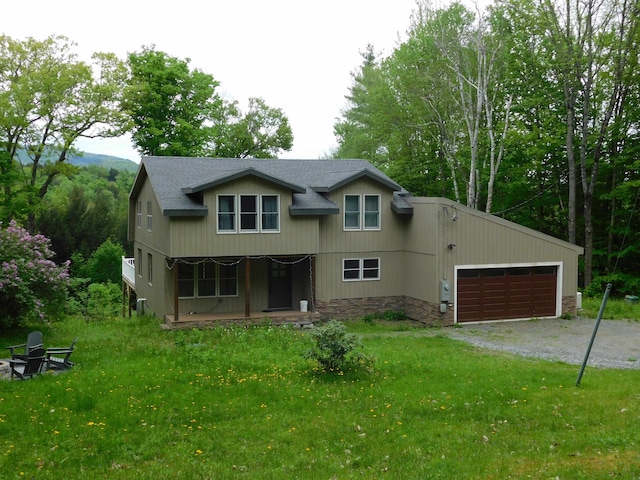 view of front of property featuring a garage and a front yard