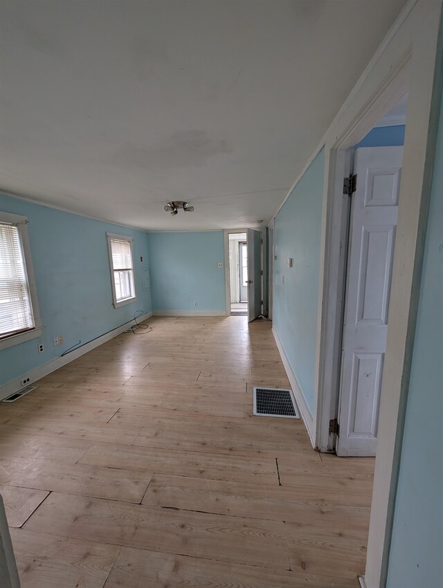 spare room featuring light hardwood / wood-style flooring