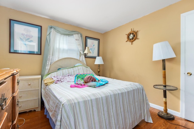 bedroom featuring wood-type flooring