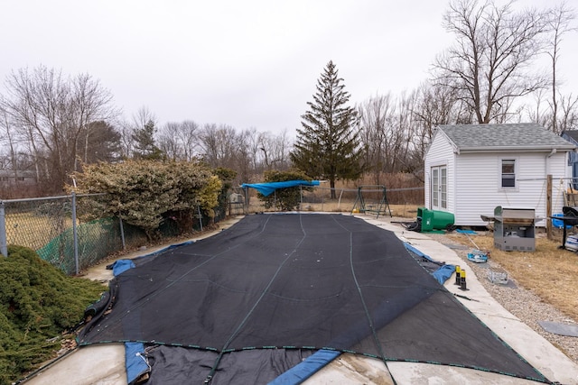 view of pool with an outdoor structure