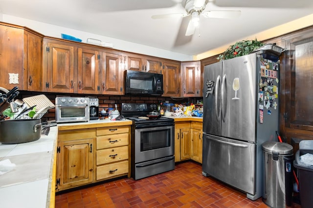 kitchen with appliances with stainless steel finishes, tasteful backsplash, and ceiling fan