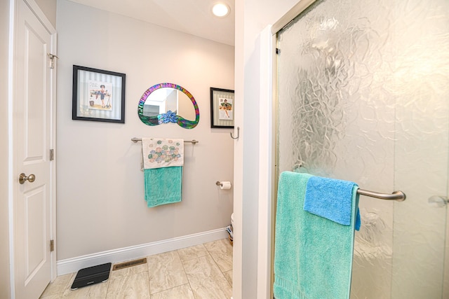 bathroom with an enclosed shower