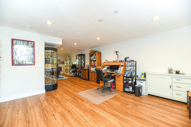 office space with light hardwood / wood-style floors