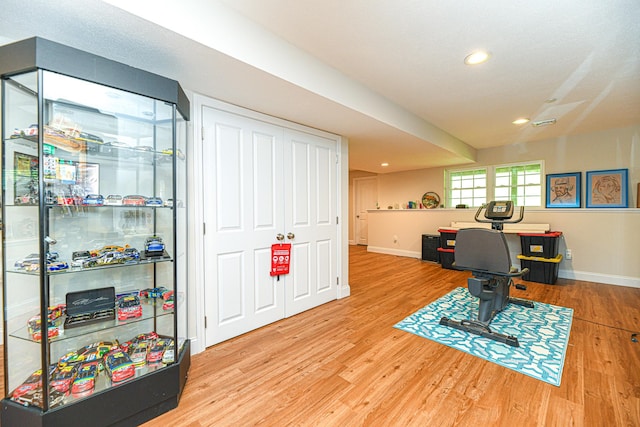 game room with wood-type flooring