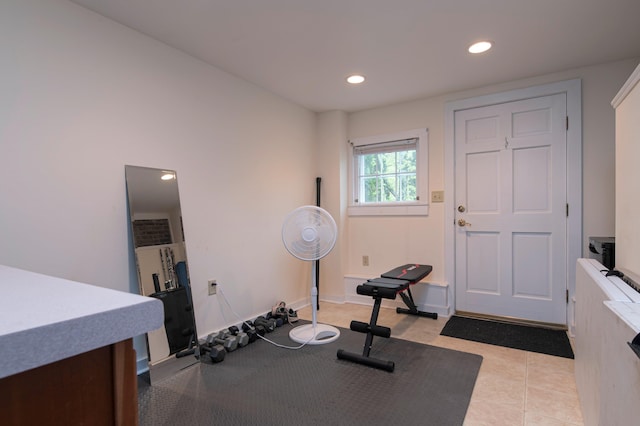 workout area featuring light tile patterned floors