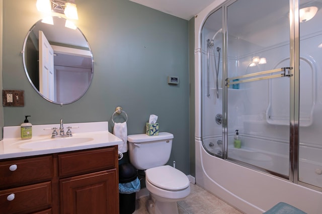 full bathroom featuring tile patterned flooring, vanity, toilet, and bath / shower combo with glass door