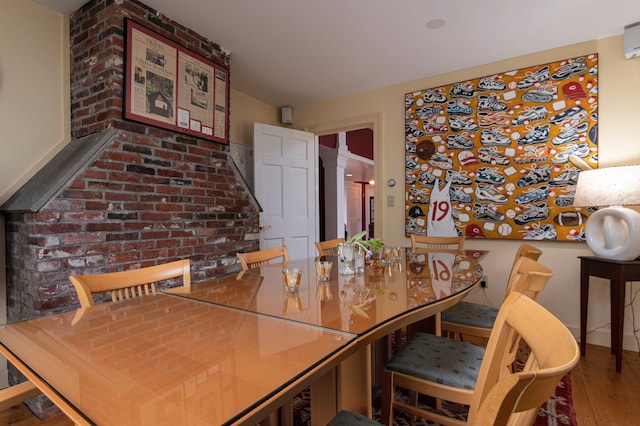 dining space featuring wood-type flooring