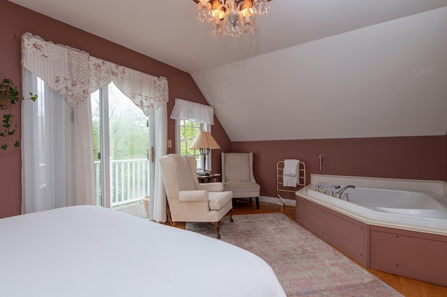 bedroom with access to outside, light hardwood / wood-style floors, an inviting chandelier, and lofted ceiling