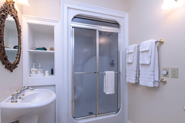 bathroom featuring sink and walk in shower