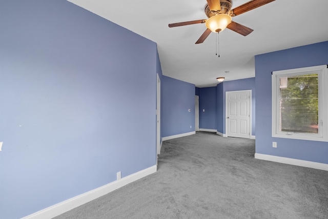 carpeted empty room with ceiling fan