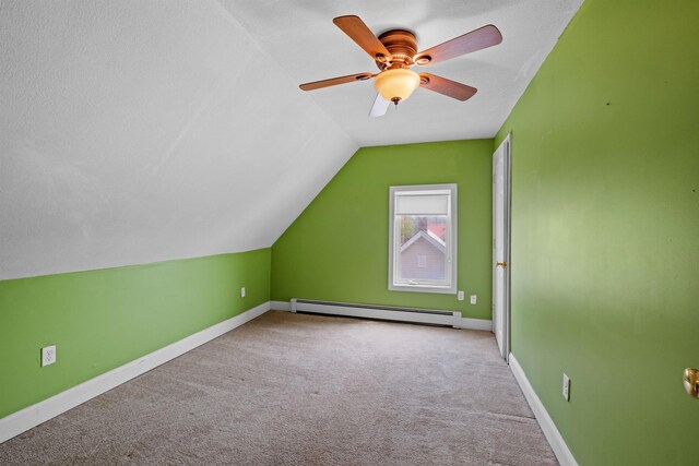 bonus room featuring ceiling fan, vaulted ceiling, light carpet, and a baseboard radiator