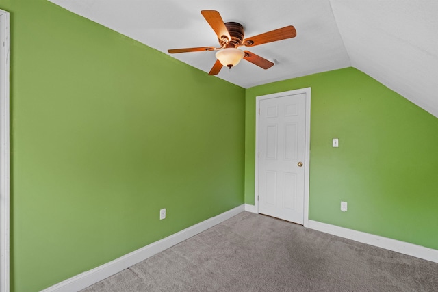 additional living space with ceiling fan, carpet, and lofted ceiling