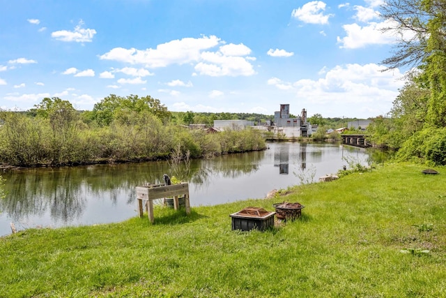 property view of water featuring a fire pit