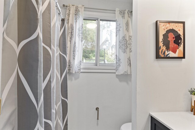 bathroom featuring vanity and toilet