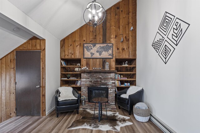 living area featuring wood walls, a baseboard radiator, wood-type flooring, and lofted ceiling