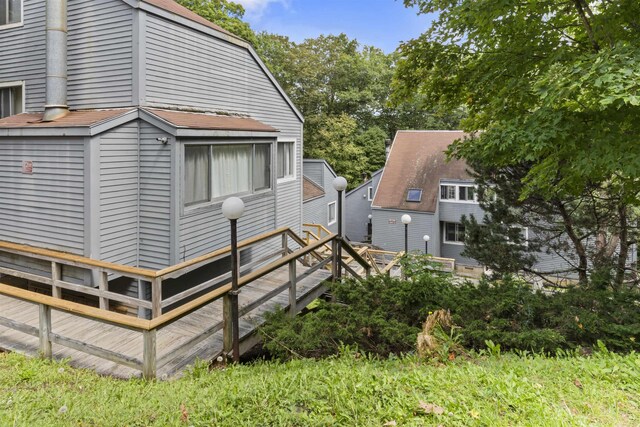 view of side of property featuring a deck