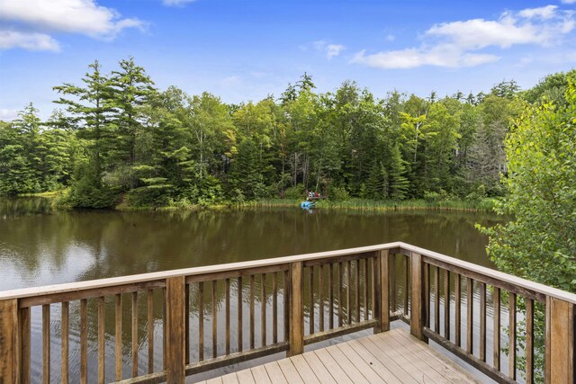 wooden deck with a water view