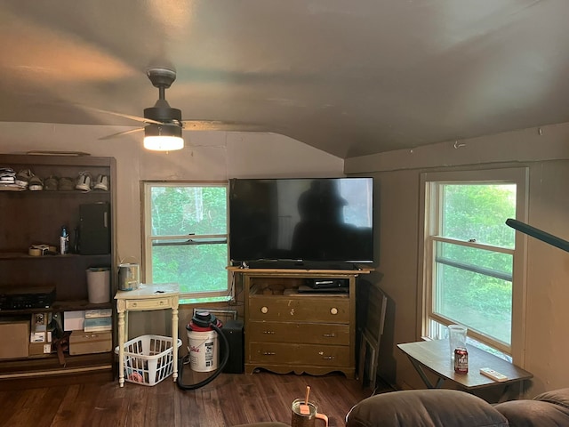 living room featuring ceiling fan, dark hardwood / wood-style flooring, and lofted ceiling