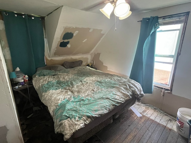 bedroom with wood-type flooring and ceiling fan