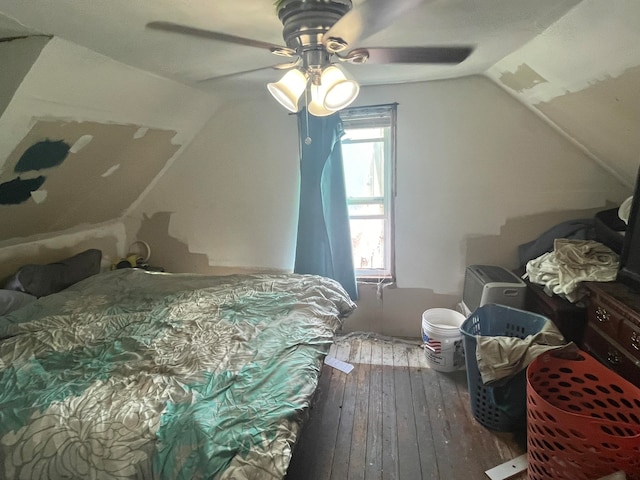 bedroom with wood-type flooring, ceiling fan, and lofted ceiling