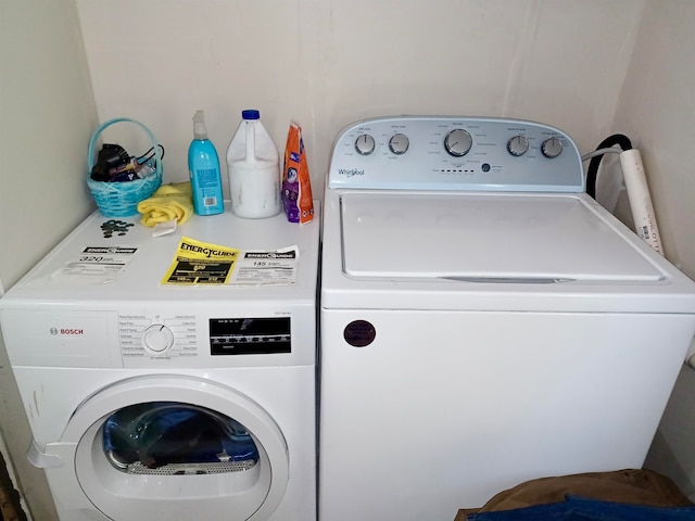 washroom with washer and dryer