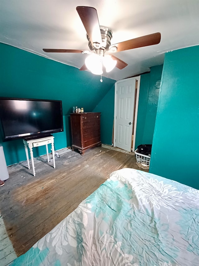 bedroom featuring ceiling fan, wood-type flooring, and vaulted ceiling