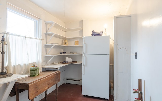 kitchen featuring white fridge and baseboard heating