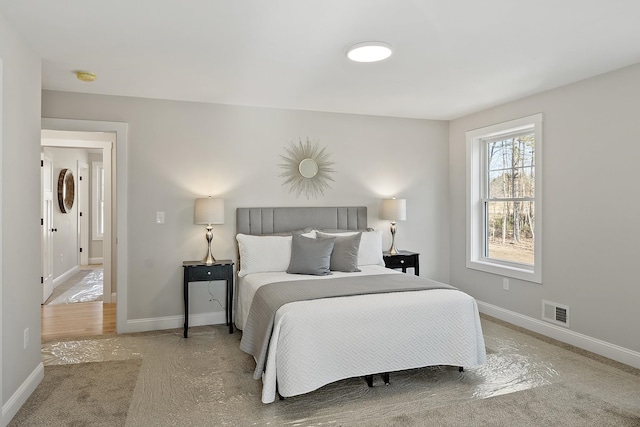 bedroom with visible vents and baseboards