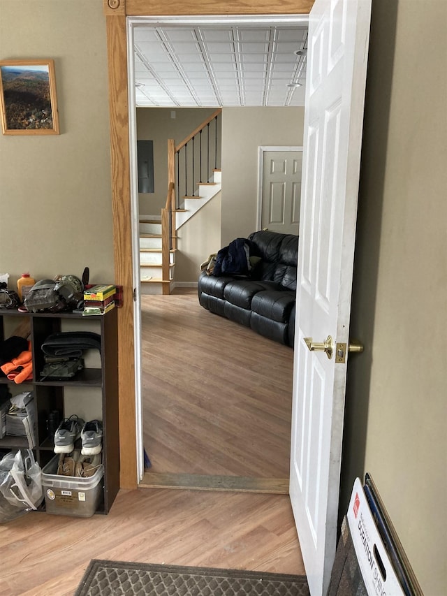 hall with stairway and wood finished floors