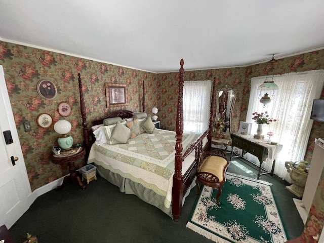 carpeted bedroom with wallpapered walls, multiple windows, and baseboards