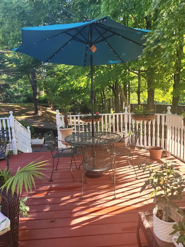wooden deck with outdoor dining area