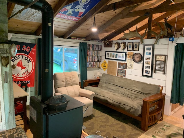 living area with lofted ceiling with beams