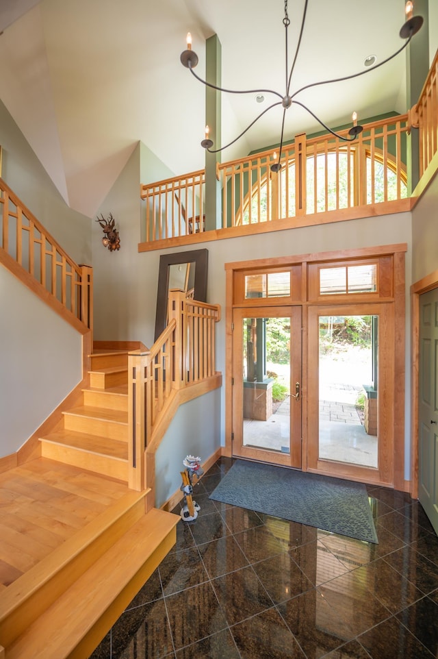 entrance foyer with a towering ceiling and french doors