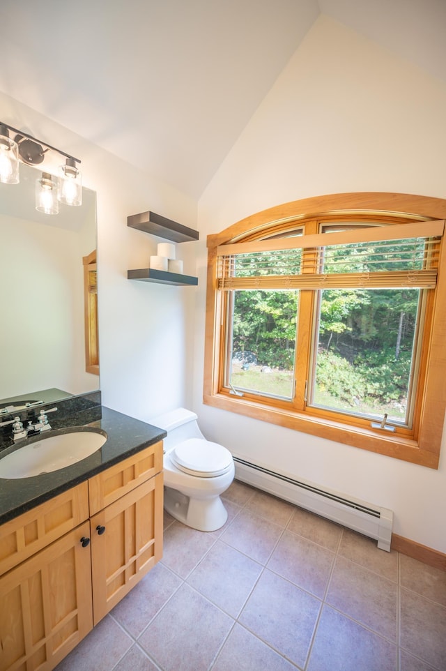 bathroom featuring baseboard heating, tile patterned floors, vaulted ceiling, toilet, and vanity