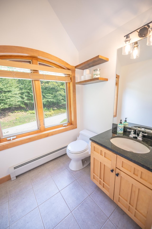 bathroom featuring a baseboard radiator, tile patterned flooring, lofted ceiling, toilet, and vanity