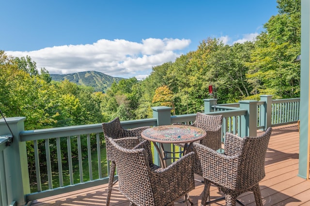 wooden terrace featuring a mountain view