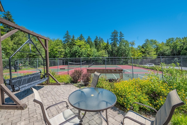 view of patio / terrace featuring tennis court