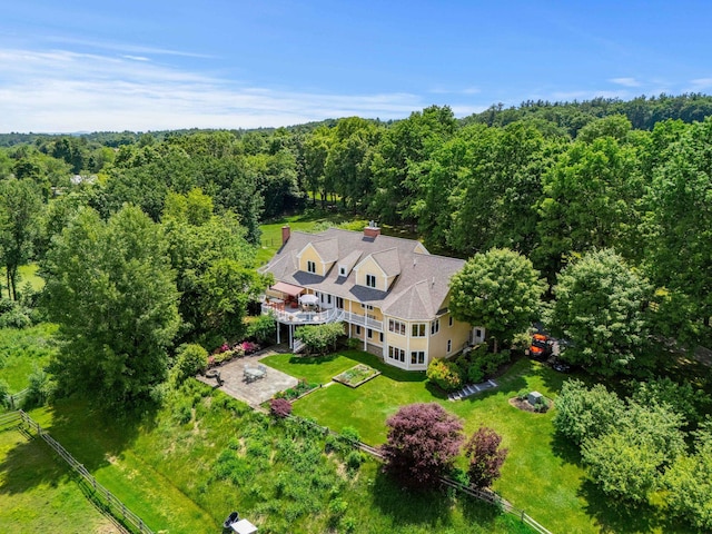 drone / aerial view with a view of trees