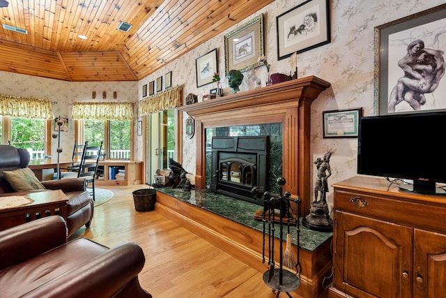 living area featuring wood finished floors, wooden ceiling, wallpapered walls, and vaulted ceiling