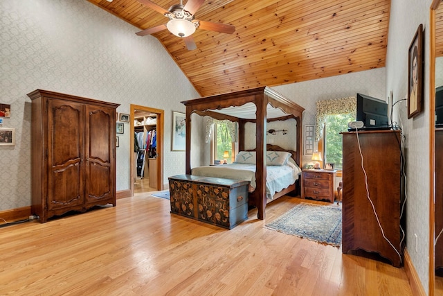 unfurnished bedroom with light wood-type flooring, multiple windows, wooden ceiling, and wallpapered walls