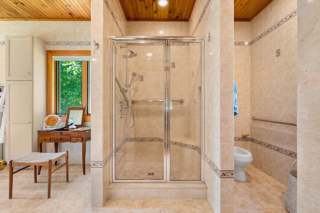 full bathroom featuring tile walls, wooden ceiling, a bidet, and a stall shower